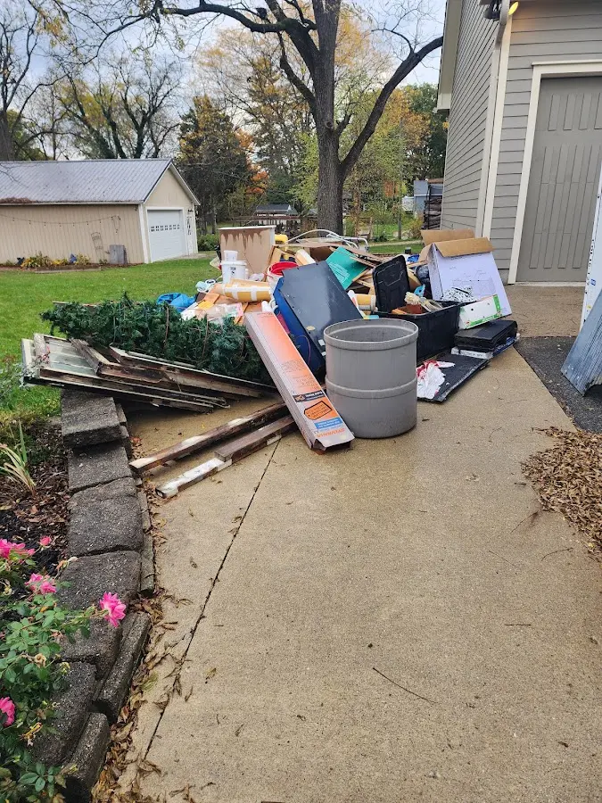 Dumpster being loaded with debris for Estate Cleanout Dumpster Rental in Hatfield
